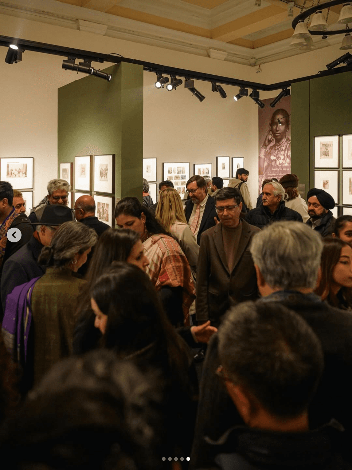 DAG Delhi Art Gallery exhibition with visitors viewing framed art
