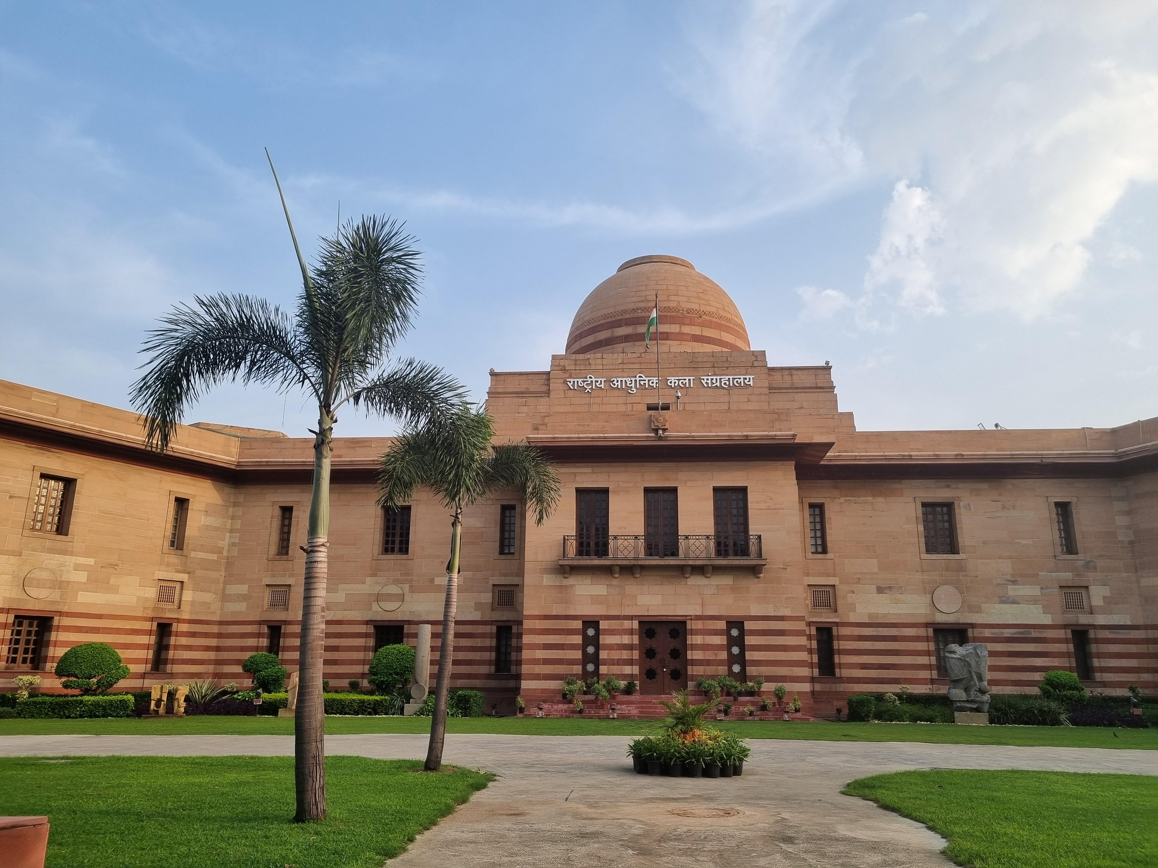 National Gallery of Modern Art, Jaipur House — sandstone facade, dome and Indian flag, New Delhi